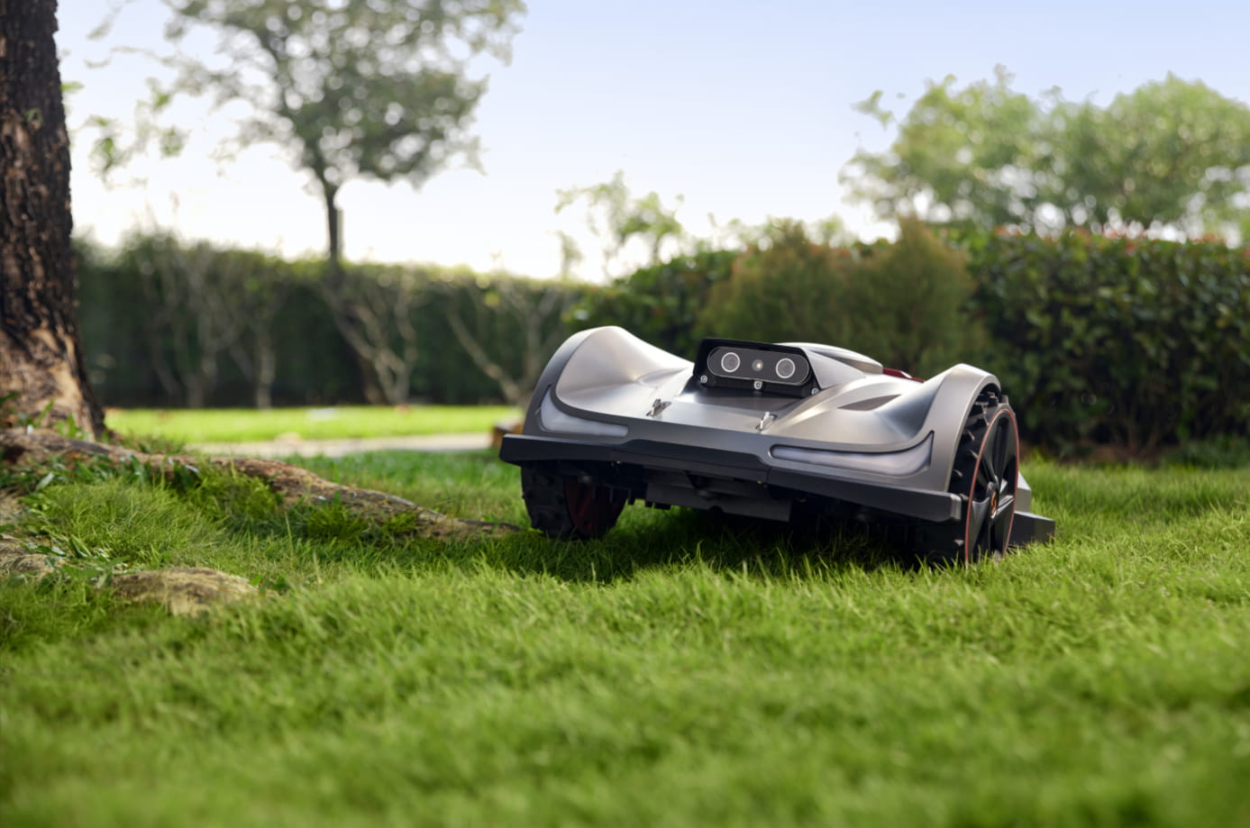 Sunseeker X7 Plus robot lawn mower operating on rough terrain